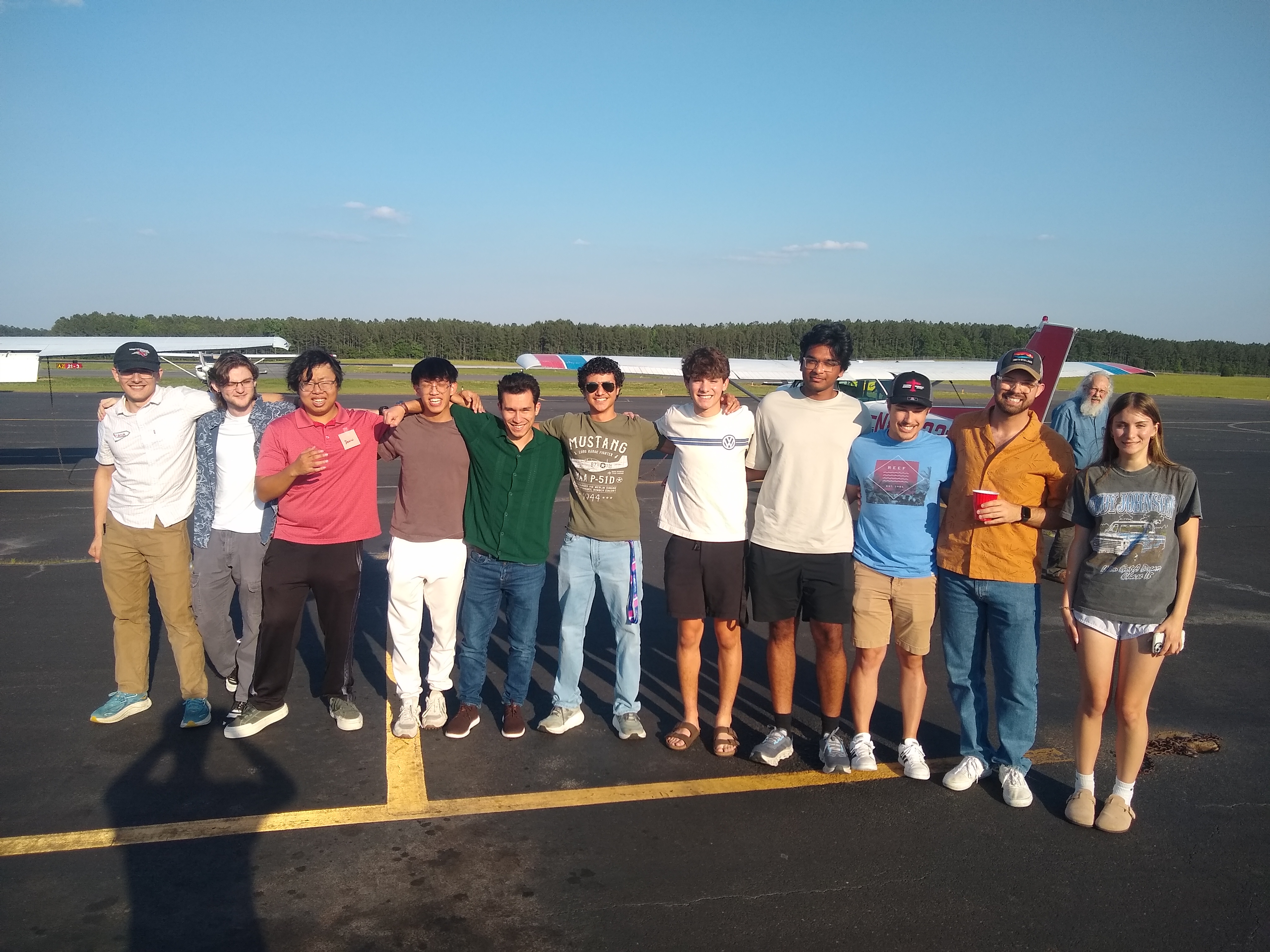 The whole group by the plane